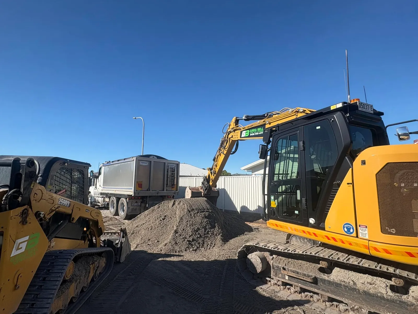 GB Civil Solutions excavator loading quarry material into a tipper truck
