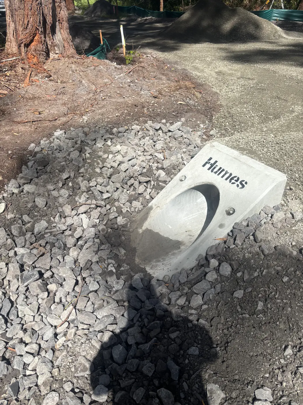 Concrete drainage pit set on a prepared gravel base