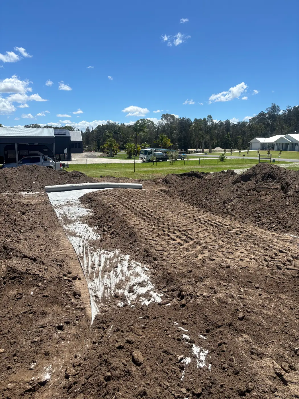 Graded pad with geotextile fabric laid before fill