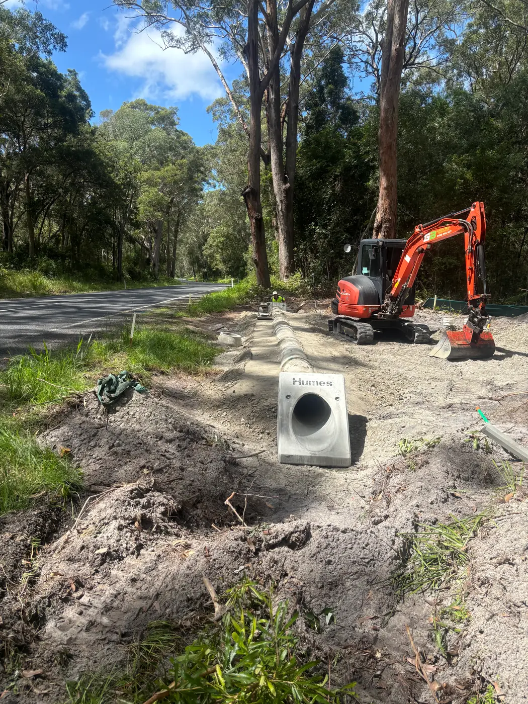 Stormwater pit and culvert installation beside a rural road