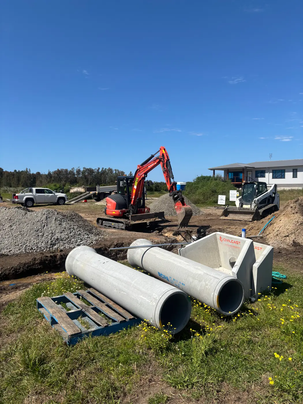 Concrete stormwater pipes and pits ready for installation on a residential site